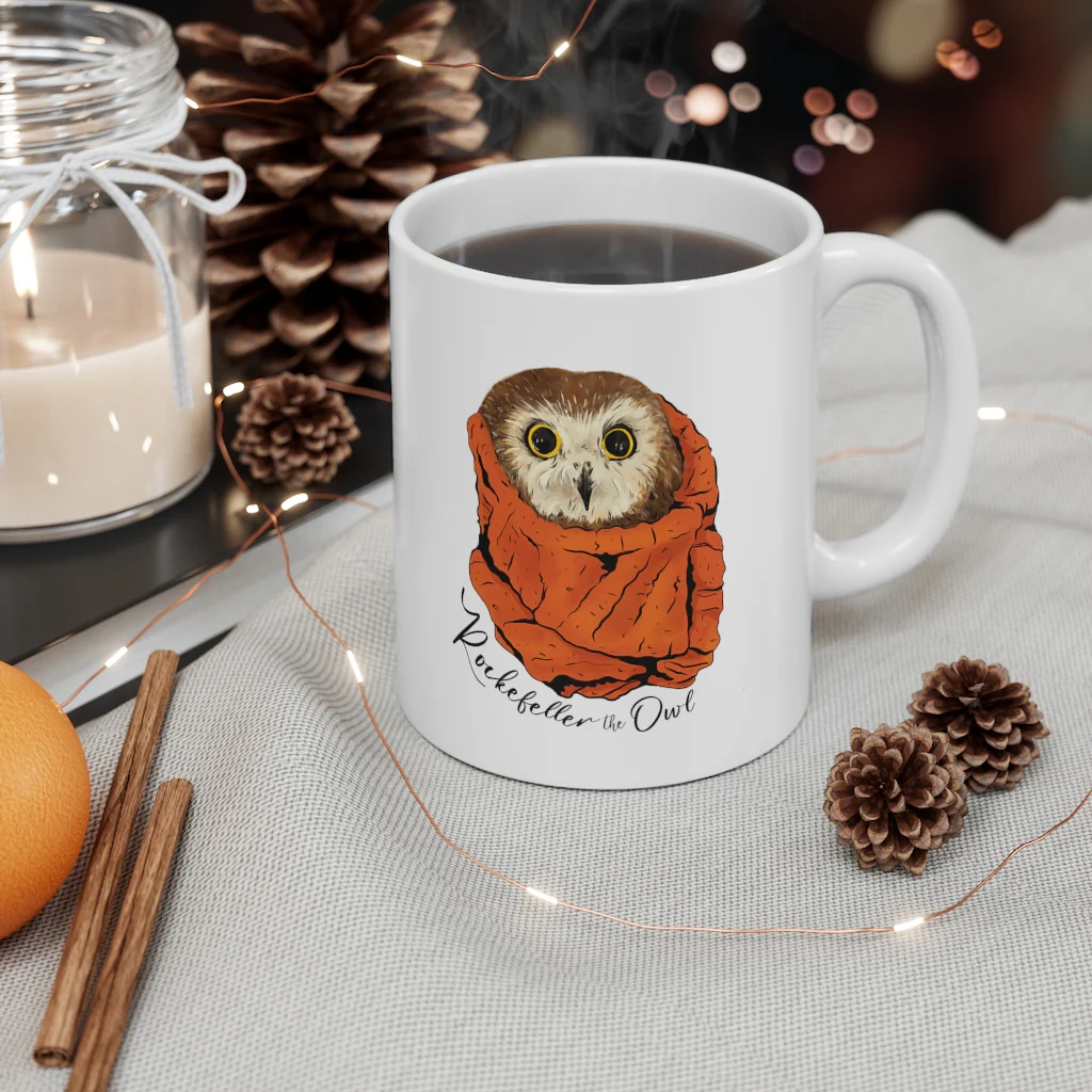 An illustration of Rocky on a coffee mug with the text "Rockefeller the owl"